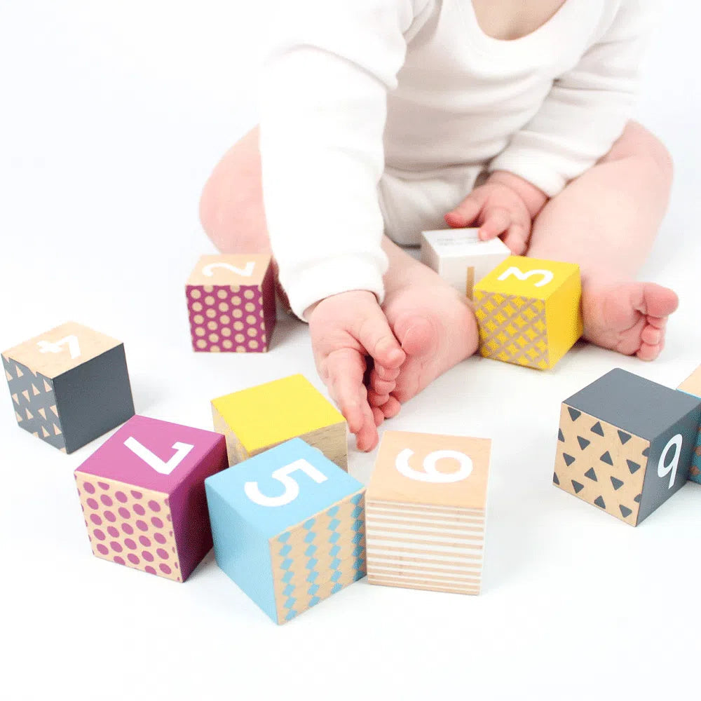 100% Fsc Certified Wooden Number Blocks,Introducing our 100% FSC Certified Wooden Number Blocks, the perfect educational tool for teaching children to count. The 100% FSC Certified Wooden Number Blocks are made from sustainably sourced wood, these blocks are not only safe for little hands but also environmentally friendly.Our number blocks are designed with vibrant patterns and bold shades to make learning fun and engaging. The lightweight construction makes them easy for young children to handle and play w