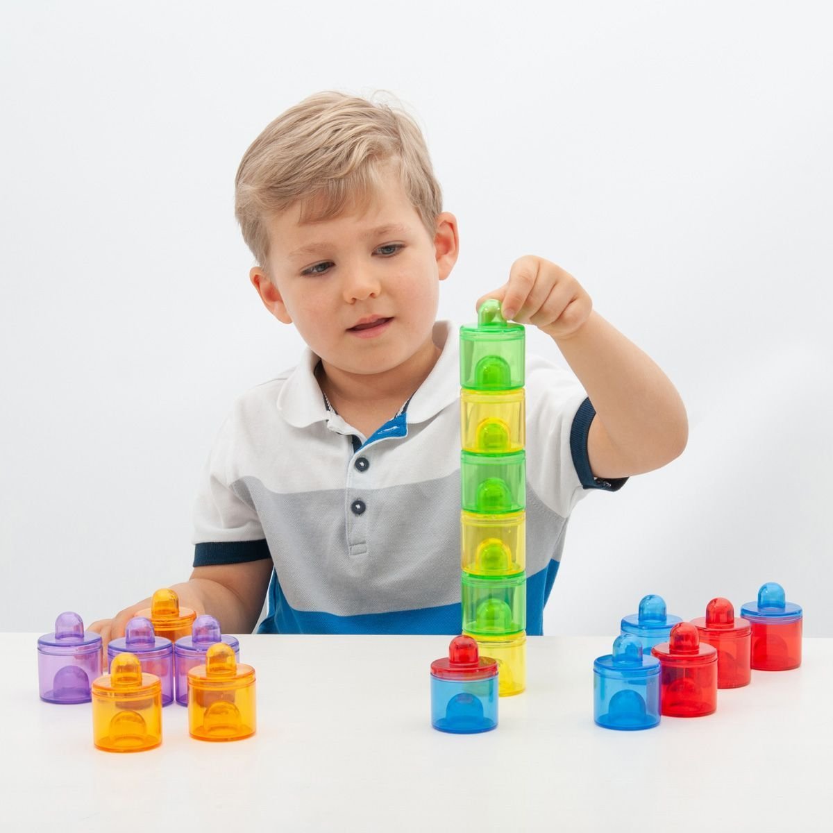 18 Piece Translucent Colour Pot Set,The TickiT® Translucent Colour Pot Set is an innovative and engaging educational toy designed to enhance your child's developmental skills through exploration play. This Translucent Colour Pot Set includes 18 small, stackable pots with lids, coming in six different translucent colors: red, orange, yellow, green, blue, and purple. The Translucent Colour Pot Set are not only perfect for exploratory play but also for activities such as colour mixing and matching, and stackin