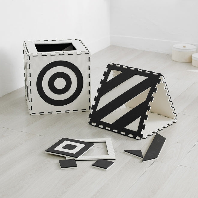 3D Creative Black And White Mats,The 3D Creative Black and White Mats offer an innovative and stimulating play environment for young children. This set of nine square mats is designed with interlocking edges, allowing for the creation of numerous shapes and configurations that can adapt to various play and learning activities. The striking black and white design, printed on both sides of five mats with a variety of patterns, not only enhances visual appeal but also provides visual stimulation crucial for ea