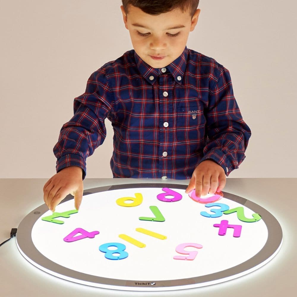 500Mm Round Light Panel,Ignite your child's curiosity and imagination with the innovative TickiT® Round LED Light Panel. This engaging tool offers a unique and captivating way to explore the properties of light, colours, and shapes, making it a must-have for interactive learning and sensory play. Designed with safety and convenience in mind, this slimline panel features safe rounded edges, an anti-trip magnetic connector, and three light level settings to suit various activities and environments. Key Featur