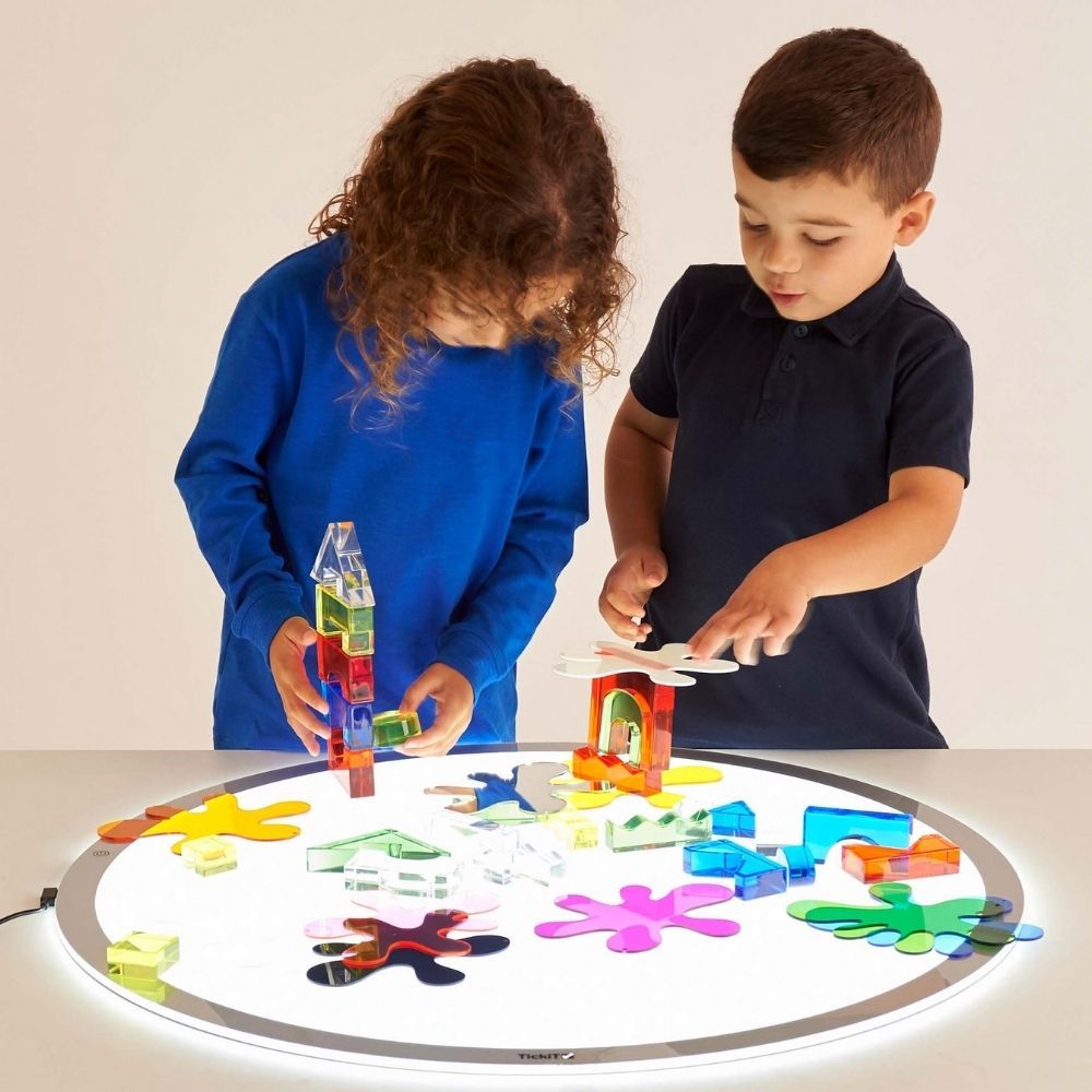 500Mm Round Light Panel,Ignite your child's curiosity and imagination with the innovative TickiT® Round LED Light Panel. This engaging tool offers a unique and captivating way to explore the properties of light, colours, and shapes, making it a must-have for interactive learning and sensory play. Designed with safety and convenience in mind, this slimline panel features safe rounded edges, an anti-trip magnetic connector, and three light level settings to suit various activities and environments. Key Featur