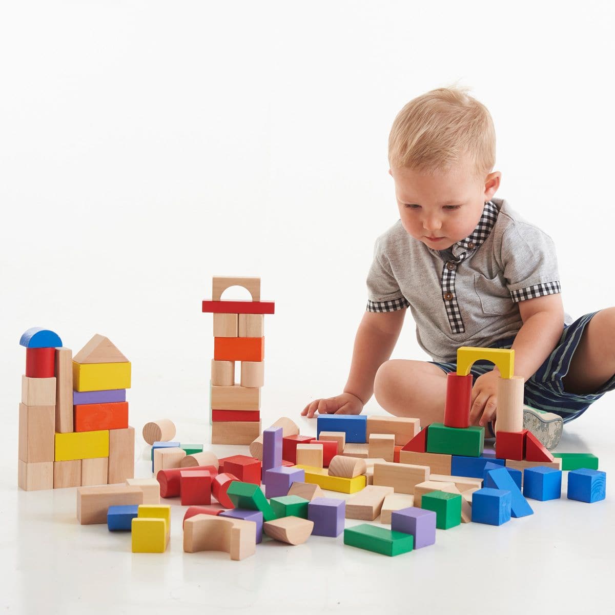 80 Wooden Blocks,The 80 Wooden Building Blocks Set is an exquisite collection designed to spark creativity and enhance developmental skills in young children. This set, featuring a vibrant array of colours and an assortment of shapes, is meticulously crafted to foster imagination, allowing children to construct towers, walls, castles, and anything else their hearts desire. The blocks are painted with child-friendly paints, ensuring safety during play, and their chunky design makes them perfect for little ha