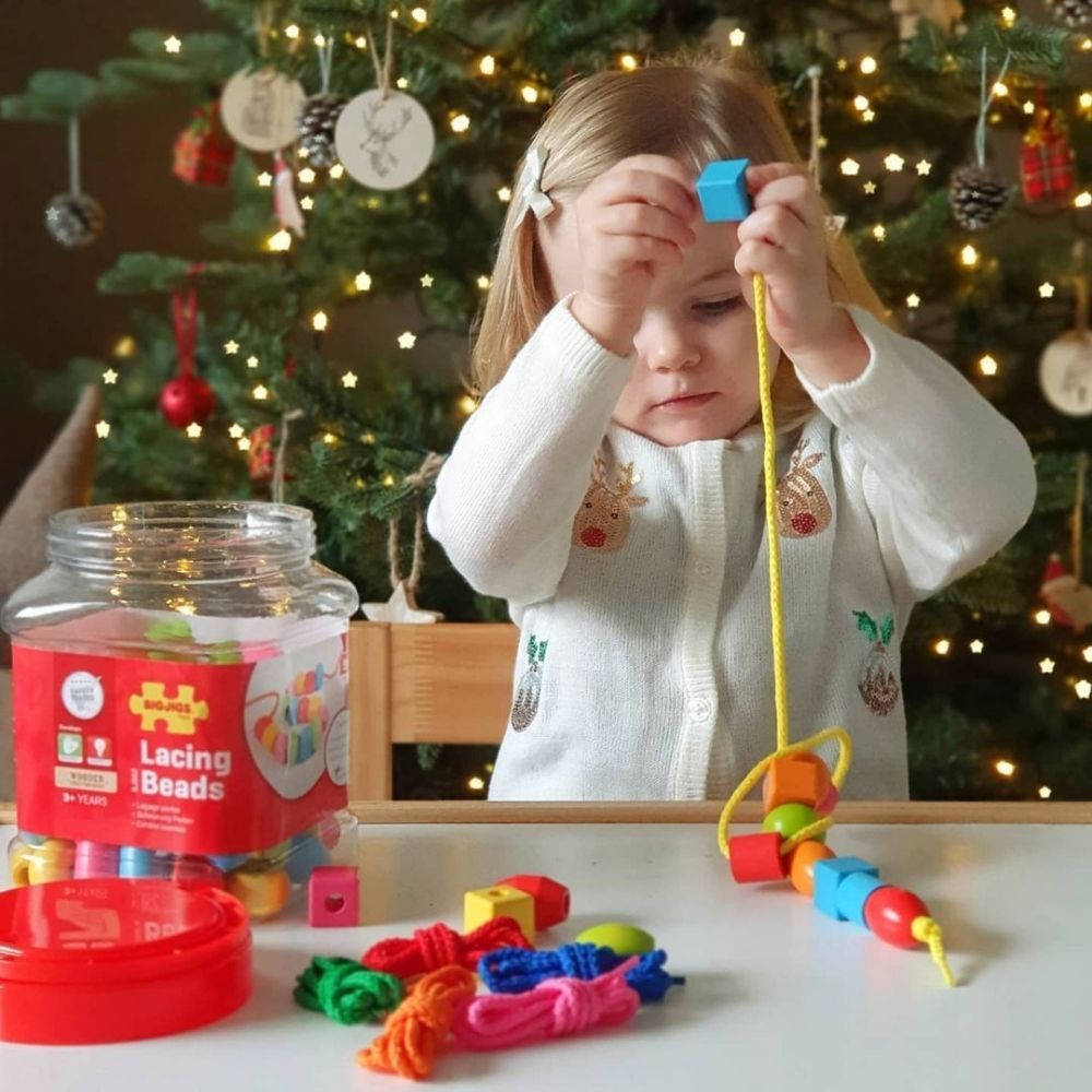 95 Piece Lacing Beads Set,The 95 Piece Lacing Beads Set is an engaging and educational toy designed to enhance a range of developmental skills in young children. Housed in a convenient screw-top jar with a built-in carry handle, this set offers a colourful array of wooden lacing beads, providing not only fun but also a valuable learning experience. With 90 beads and 5 laces included, children can create endless designs by combining different shapes and colours, promoting creativity and imagination. Key Feat