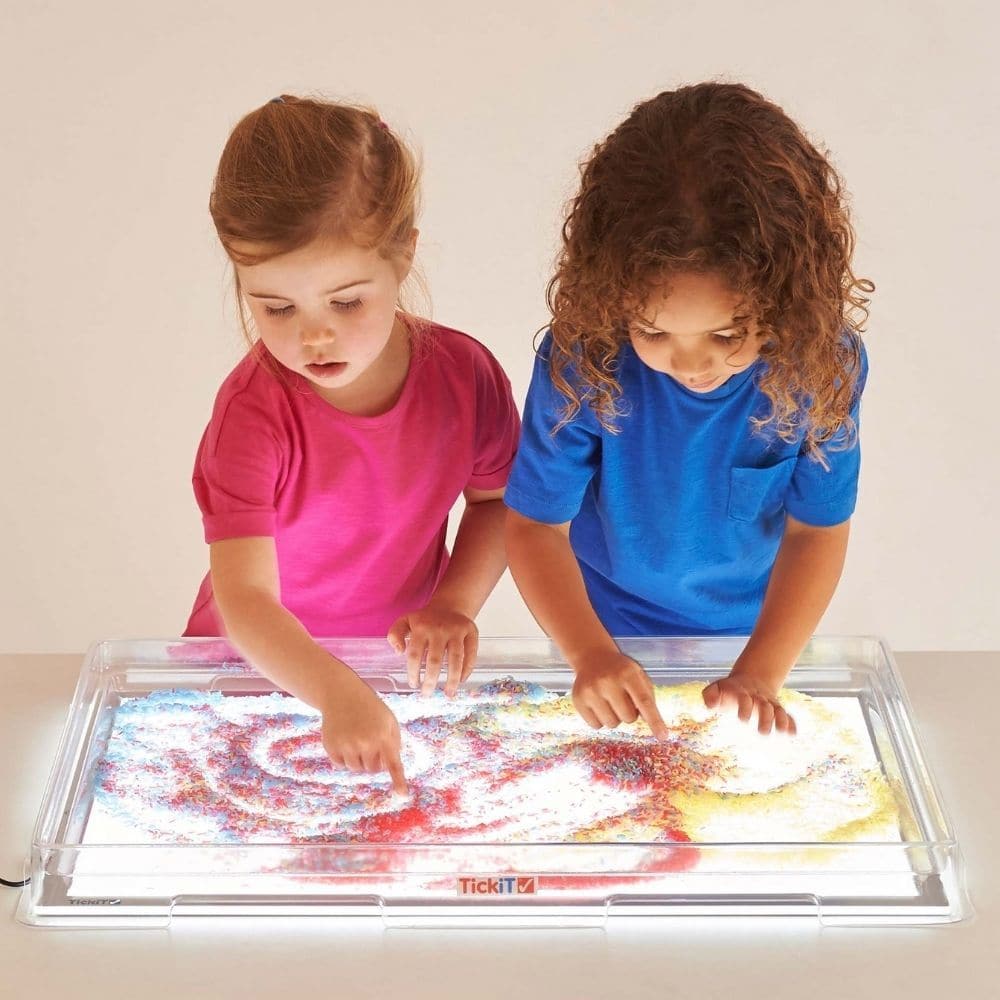 A2 Light Panel Cover,The A2 Light Panel Cover is a versatile and essential accessory designed to enhance the use of our A2 Light Panel. This large, clear, shallow thermoplastic cover is meticulously crafted to fit perfectly over the A2 Light Panel, transforming it into an illuminated container ideal for a wide range of activities including art, craft, messy play, sensory exploration, and small world play. Our TickiT® Light Panel Covers are specifically tailored to complement our white TickiT® Light Panels, 