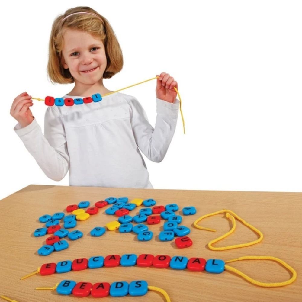 Alphabet Threading Beads,The Alphabet Threading Beads set is a vibrant and educational toy designed to engage children in the fun and interactive learning of letters and spelling. With its bright, chunky beads featuring both lower and uppercase letters, this set is a fantastic resource for reinforcing letter recognition, alphabet sequencing, and spelling skills. Key Features of the Alphabet Threading Beads: Colour-Coded for Learning: The beads are colour-coded, with vowels in red and consonants in blue, mak