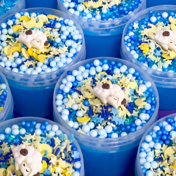 Counting Sheep Putty,Our Counting Sheep putty is designed to be the most relaxing experience yet! Infused with a gentle, soothing sweet blend scent, it offers a calming aroma that helps create a tranquil atmosphere. Topped with blue floam beads, shimmering blue bingsu beads, and a mixture of dreamy moon and star sprinkles, this putty creates a serene visual landscape that invites relaxation. The combination of blue and purple putty further enhances the calming effect, promoting a sense of peace and tranquil