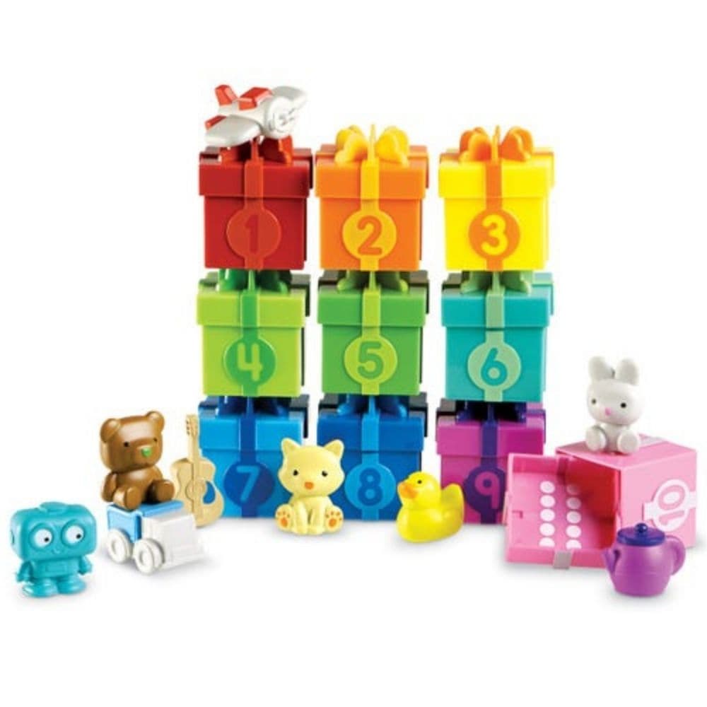 Counting Surprise Party,The Counting Surprise Party is a delightful learning toy designed to provide hours of educational fun for your child. This collection includes a range of numbered boxes, each containing a different colourful object. The boxes are adorned with numerals on the front and a dot array inside the lid, making it easy for children to match the lid to the correct numbered box. Each box is a treasure trove of fun, containing various objects from a friendly cat to a vibrant purple teapot. These