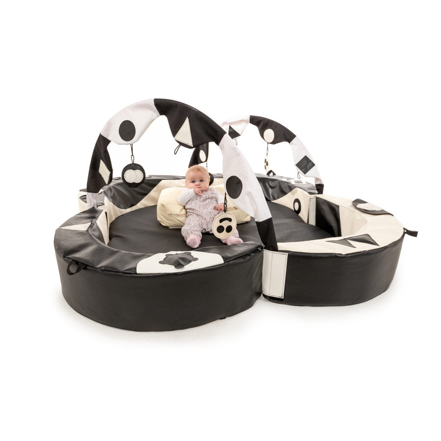 Crescent Ring Super Set Black And White,The Crescent Ring Super Set is top of the range and designed to create a real impact with nursery staff, babies and their mothers. The Black and White colours are designed to aid early development of sight. It looks spectacular and has space for up to 5 babies. It is superbly designed to help with early development. It surrounds a young baby with tactile, visual and sound stimulation, encouraging them to take notice and explore their surroundings. The soft foam walls 