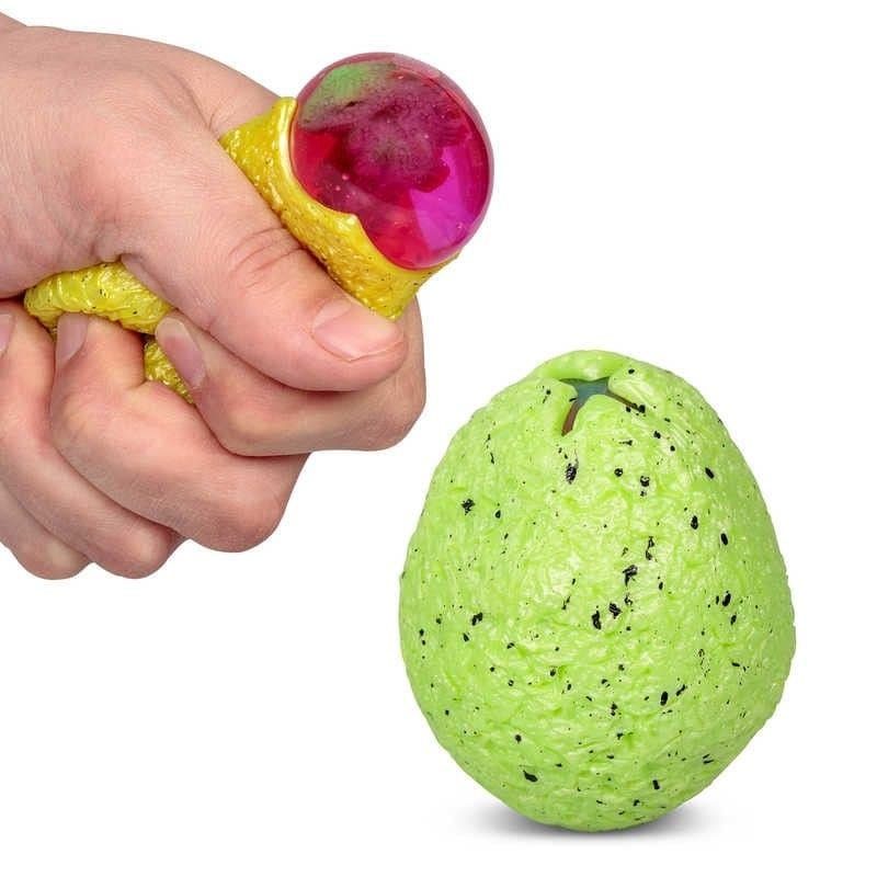 Dinosaur Squeeze And Reveal Egg,The Dinosaur Squeeze Egg offers a delightful and surprising twist on the traditional squeeze toy, perfect for dinosaur enthusiasts and collectors alike. This colourful toy egg, available in an array of shades including yellow, green, grey, and purple, conceals a charming secret—a tiny dinosaur figure encapsulated within a liquid-filled bubble that magically appears when the egg is squeezed. Dinosaur Squeeze And Reveal Egg Features: Squeeze to Reveal: Applying pressure to the 