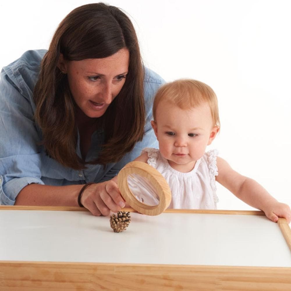 Easy Hold Wooden Hand Lens,This Easy Hold Wooden Hand Lens is easy to use and an ideal sized Magnifier for exploring the world. The Easy Hold Wooden Hand Lens provides upto 2x magnification and the inset lens offers 3 times magnification , and makes all small things become big and allows a child to explore the smaller details of the world up close. The Easy Hold Wooden Hand Lens makes small insects become Giant Insects, and small letters become large font type. Allow your Child's inquisitive mind to self ex