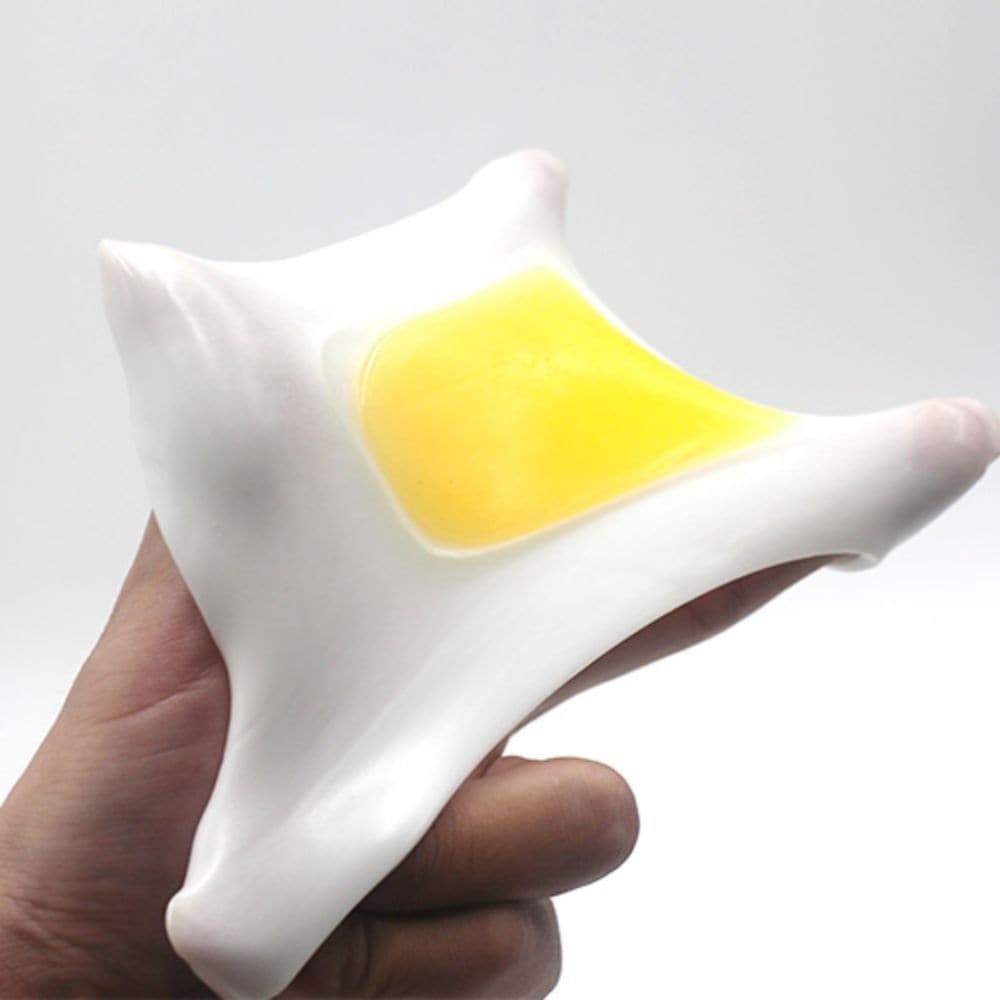 Egg Squeezing Venting Toy,The Egg Squeezing Venting Toy is the ultimate stress relief tool that is sure to soothe your nerves. Made of soft and flexible rubber, this unique stress ball will provide endless hours of tactile entertainment. When you squeeze it, a realistic looking egg yolk will appear in your hand, giving you the feeling of actually holding an egg in your palm.Its rubbery texture makes it comfortable to hold and the egg yolk adds a fun element to your stress relief routine. Not only is it a gr