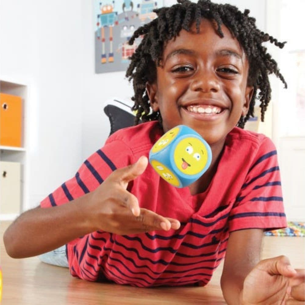 Emoji Cubes,The Emoji Cubes set is an innovative educational tool designed to enhance emotional literacy and self-awareness in early learners. This engaging set uses the universal appeal of emojis to help children identify and express their feelings, fostering both individual emotional growth and social skills. Key Features: Brightly Coloured Emoji Cubes: Each cube is vividly colored, making them visually appealing to young children and easy to engage with. Emoji and Written Prompt Cubes: The set includes t