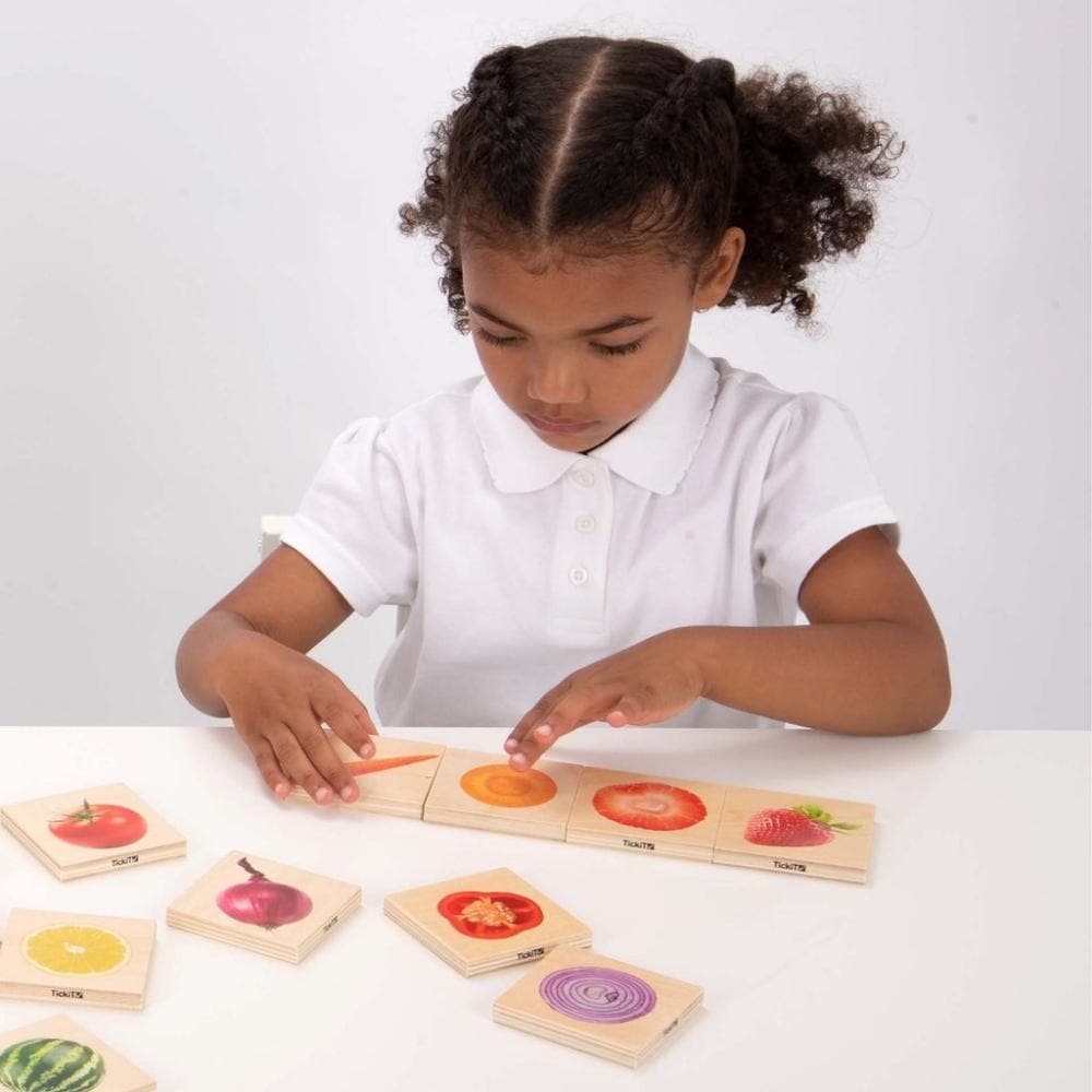 Fruit And Vegetable Match,The Fruit and Vegetable Match games is a fun and versatile wooden game, our TickiT® Fruit & Vegetable Match is a set of fourteen pairs of smooth tactile basswood ply tiles with a clear colour print on one side of real photographic images of fruits and vegetables. The square chunky tiles are easy for your child to hold and turn over in their hands. The Fruit and Vegetable Match is fun to use in the following ways:• A matching game - turn all the tiles face up and match the whole fru