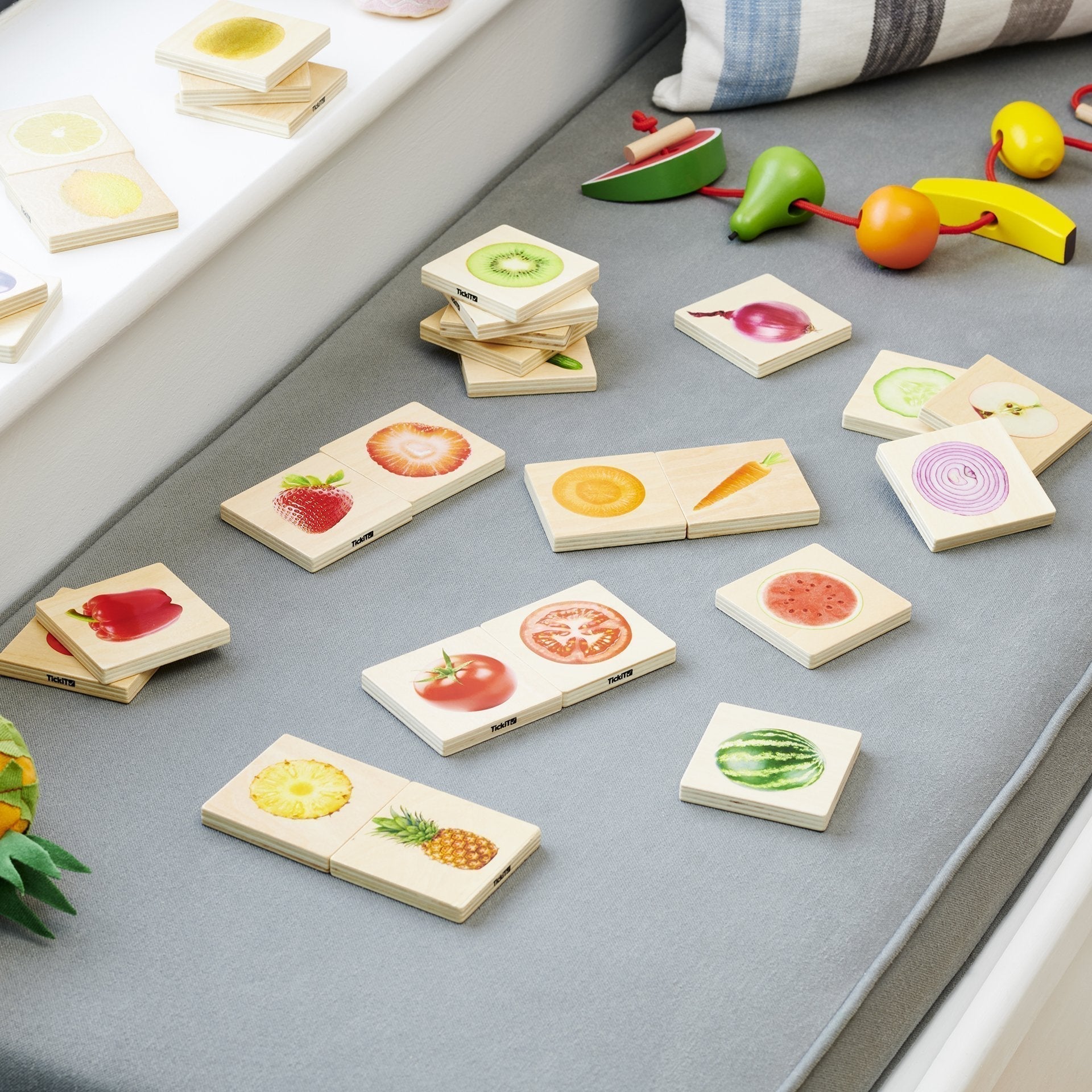 Fruit And Vegetable Match,The Fruit and Vegetable Match games is a fun and versatile wooden game, our TickiT® Fruit & Vegetable Match is a set of fourteen pairs of smooth tactile basswood ply tiles with a clear colour print on one side of real photographic images of fruits and vegetables. The square chunky tiles are easy for your child to hold and turn over in their hands. The Fruit and Vegetable Match is fun to use in the following ways:• A matching game - turn all the tiles face up and match the whole fru