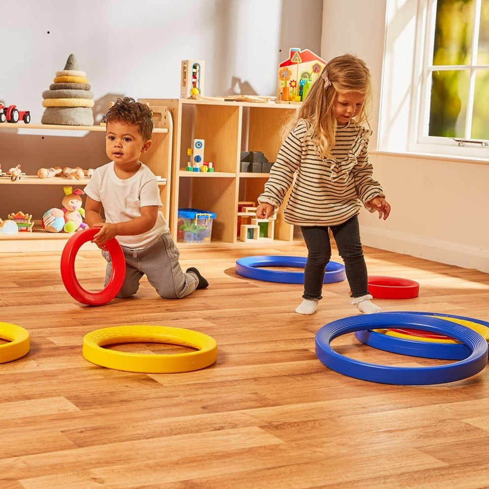 Giant Plastic Activity Rings Set,Introduce a vibrant and engaging learning tool into your child's playtime with the Giant Plastic Activity Rings Set. This set includes nine high-quality plastic rings in three distinct sizes—small, medium, and large—each colour-coded for easy recognition and comparison. Designed to stimulate both physical and cognitive development, these rings are perfect for children aged 12 months and older. Whether used indoors or outdoors, the Giant Plastic Activity Rings Set offers endl