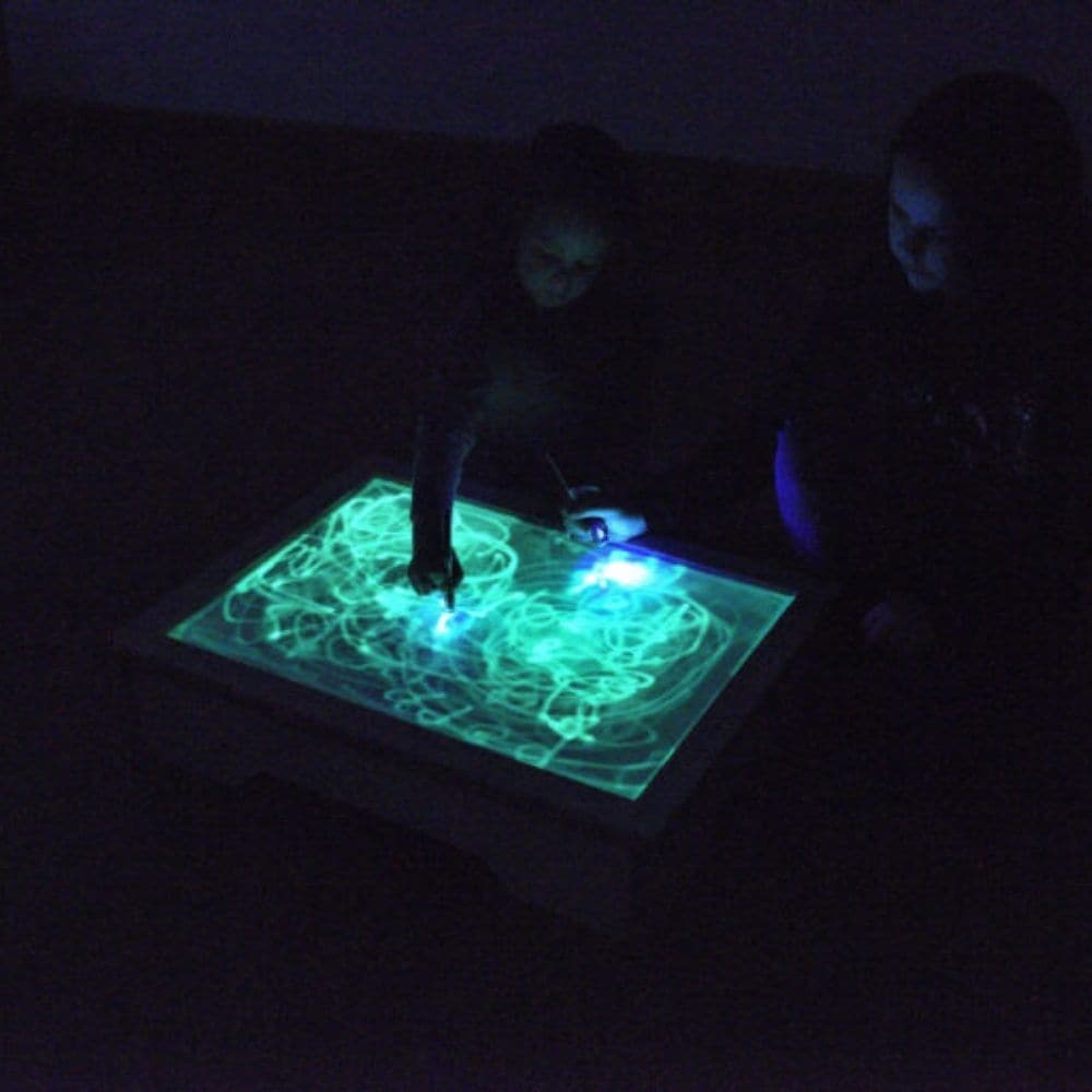 Glo Table,Unlock a world of sensory exploration and creative play with the Glo Table, an innovative educational resource perfect for early mark making and the development of fine and gross motor skills. Specially designed to engage young learners and children with special educational needs, the Glo Table offers a unique, sensory experience that captivates and educates. This table is not just a drawing surface; it's a dynamic tool that encourages children to use larger, whole-arm movements, crucial for build