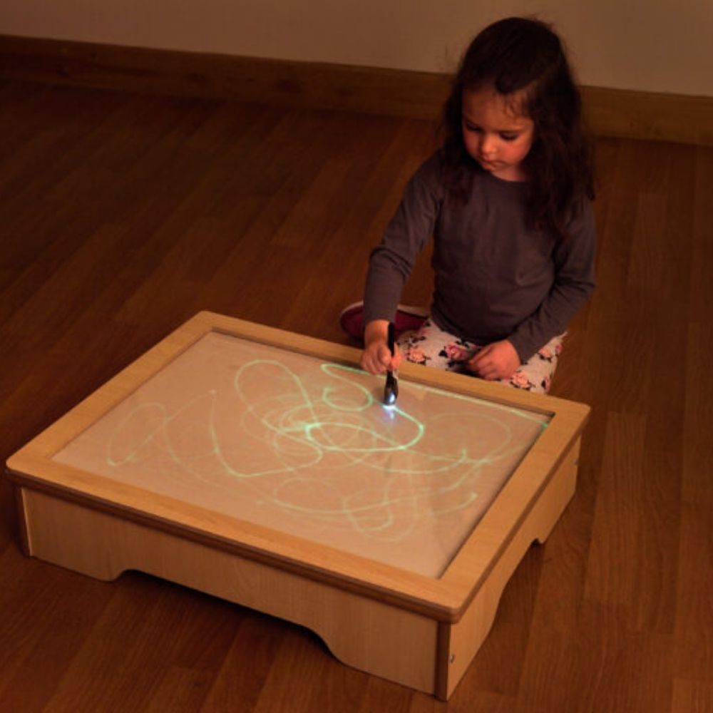 Glo Table,Unlock a world of sensory exploration and creative play with the Glo Table, an innovative educational resource perfect for early mark making and the development of fine and gross motor skills. Specially designed to engage young learners and children with special educational needs, the Glo Table offers a unique, sensory experience that captivates and educates. This table is not just a drawing surface; it's a dynamic tool that encourages children to use larger, whole-arm movements, crucial for build