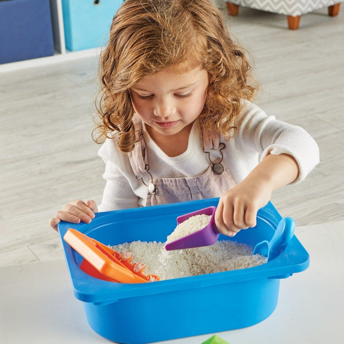 Helping Hands Sensory Scoops,Introduce your child to a world of sensory exploration and fine motor skill development with the Helping Hands Sensory Scoops. This colourful set of four scoops is designed specifically for little hands, making it easy and fun for children to pour, sift, funnel, and scoop their way to stronger hand muscles and better coordination. Perfect for use at home, in the classroom, or in various play spaces, these scoops add a touch of sensory excitement to any activity. Helping Hands Se