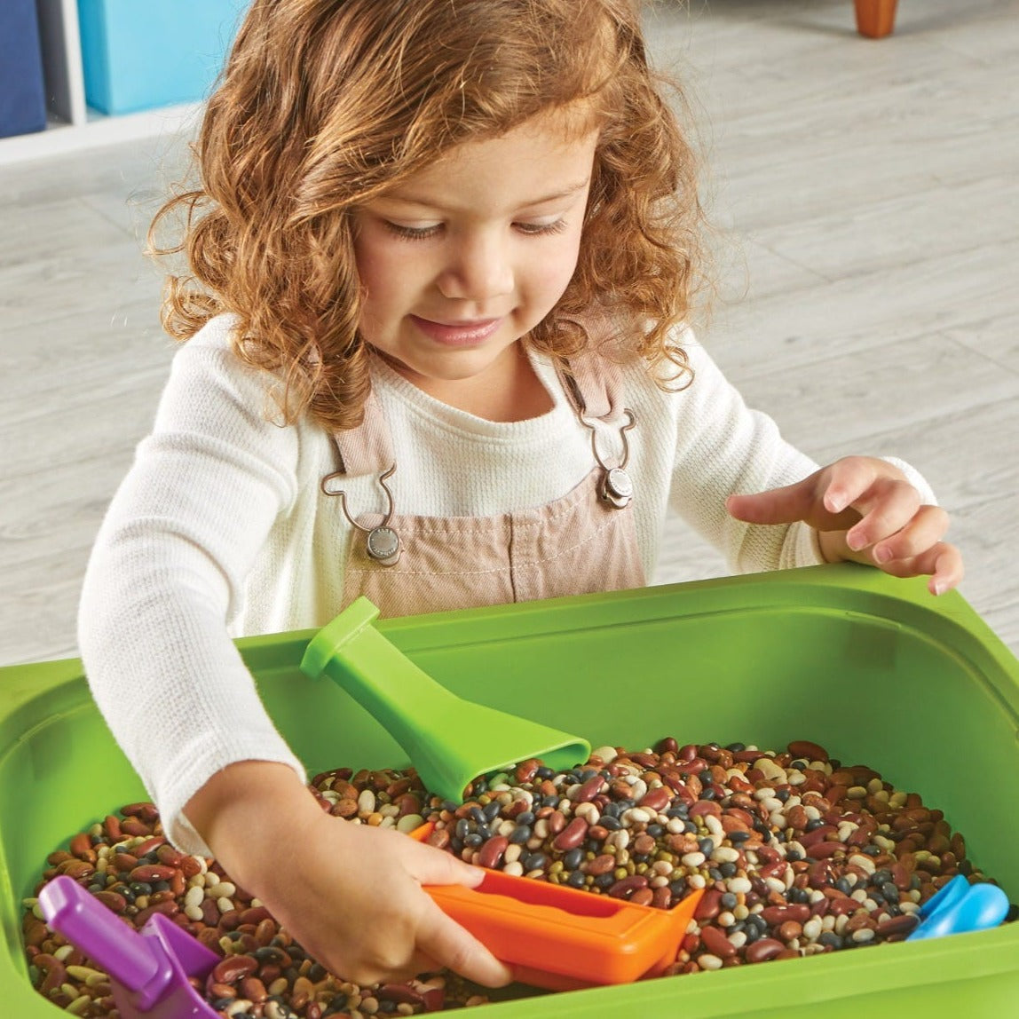 Helping Hands Sensory Scoops,Introduce your child to a world of sensory exploration and fine motor skill development with the Helping Hands Sensory Scoops. This colourful set of four scoops is designed specifically for little hands, making it easy and fun for children to pour, sift, funnel, and scoop their way to stronger hand muscles and better coordination. Perfect for use at home, in the classroom, or in various play spaces, these scoops add a touch of sensory excitement to any activity. Helping Hands Se