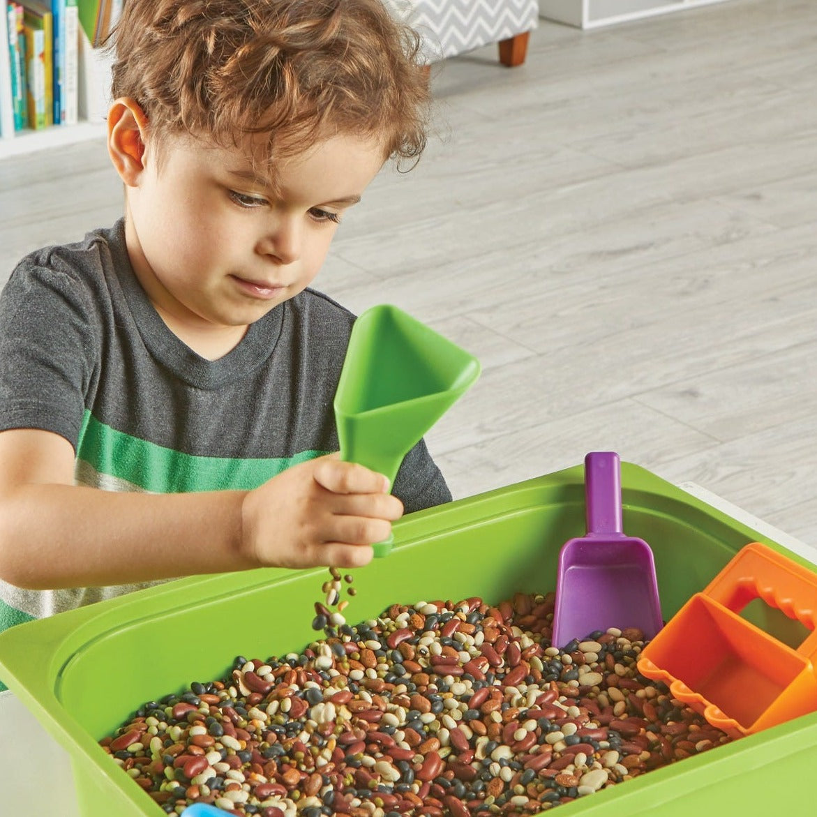 Helping Hands Sensory Scoops,Introduce your child to a world of sensory exploration and fine motor skill development with the Helping Hands Sensory Scoops. This colourful set of four scoops is designed specifically for little hands, making it easy and fun for children to pour, sift, funnel, and scoop their way to stronger hand muscles and better coordination. Perfect for use at home, in the classroom, or in various play spaces, these scoops add a touch of sensory excitement to any activity. Helping Hands Se