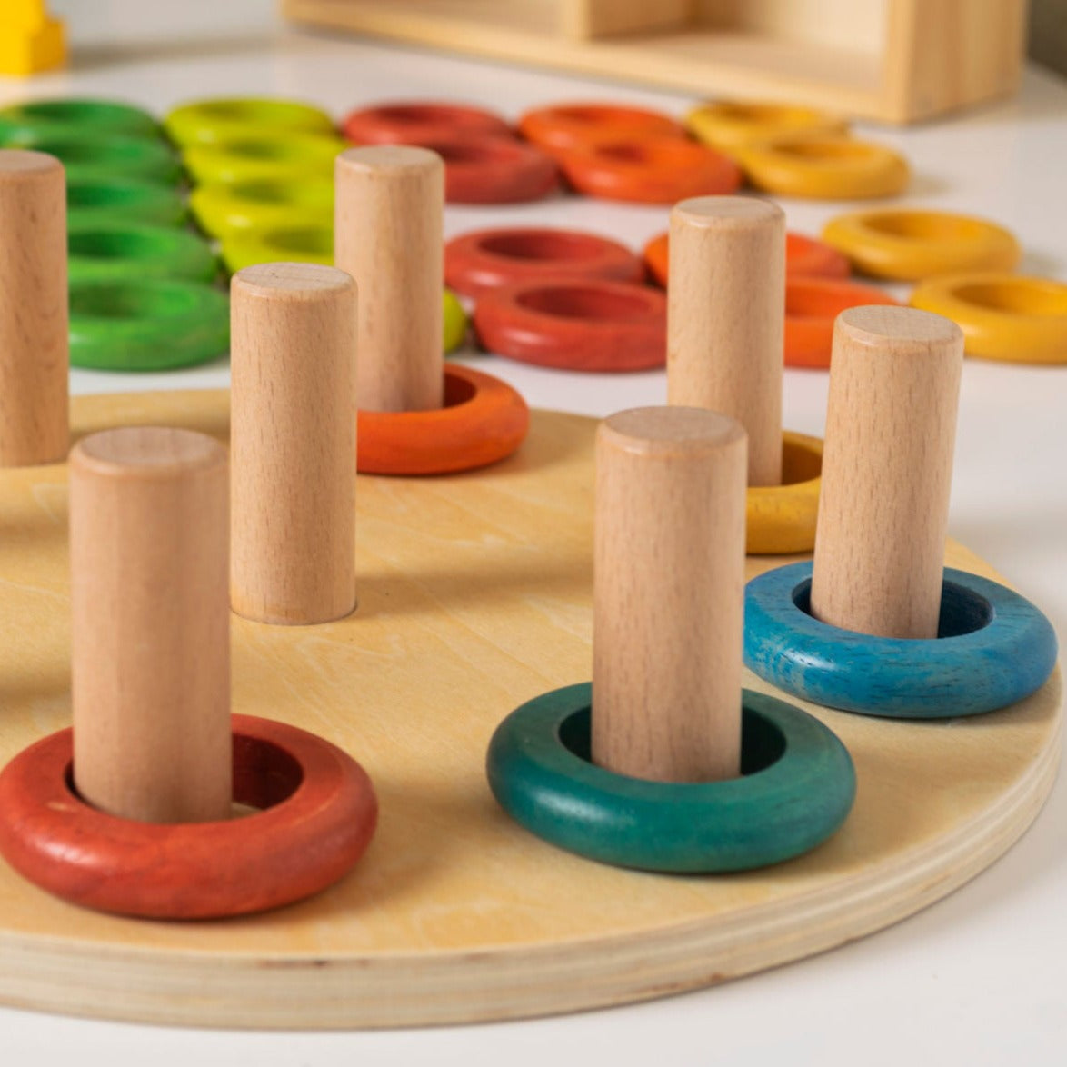 Hooping Rings,Introducing our Hooping Rings 9-piece wooden ring set, designed to inspire creativity and learning in young children! The Hooping Rings set is made from sustainably sourced beech wood, rubber wood, and plywood, this set is both durable and eco-friendly.Featuring 5 rings in each bright and engaging colour, children can use their imaginations to stack the rings in order, create patterns, or even come up with their own designs. The possibilities are endless with this open-ended set!Not only is th