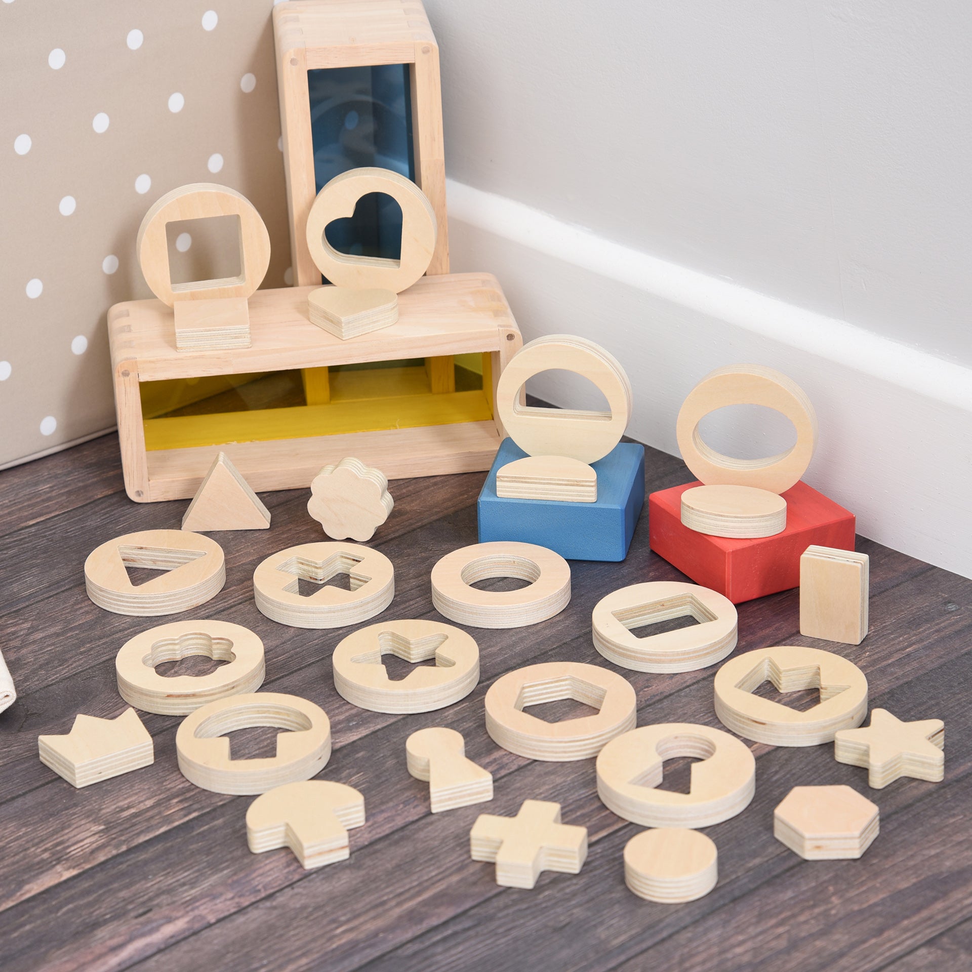 Inside Outside Wooden Shapes,The TickiT® Inside Outside Wooden Shapes set provides exciting and stimulating fun for your child to explore shape sorting and puzzle solving. This set is designed to enhance fine motor skills, hand-eye coordination, and early mathematical understanding through interactive play. Inside Outside Wooden Shapes Features Smooth and Tactile Design: Each of the 14 wooden discs is smooth and tactile, perfect for small hands to handle. The chunky, 1.2cm thick removable shapes are easy fo