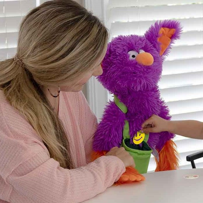 Interactive Edgar The Emotions Puppet,Introduce your children to Interactive Edgar The Emotions Puppet, a uniquely designed educational tool that makes learning about emotions fun and engaging. Edgar is not just a puppet; he is a vibrant character with super-soft fur and a silly face, created to help children express and understand their own emotions. Suitable for children aged 3 and up, Edgar serves as a gentle intermediary for discussions about feelings. This puppet comes with a bright green pouch contain