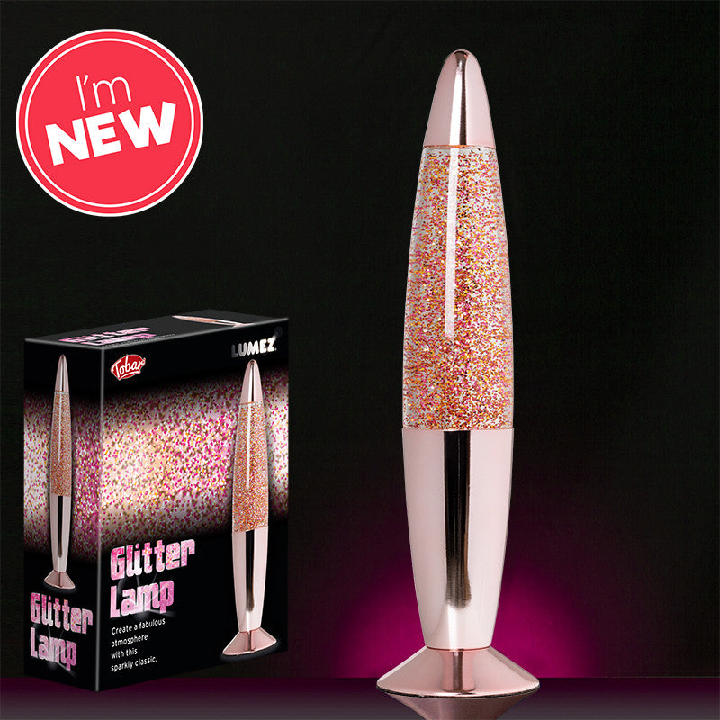 Lumez Glitter Lamp - Rose Gold,Step back in time with the Lumez Glitter Lamp in Rose Gold, where classic retro styling meets modern elegance. This striking lamp features a warm rose gold finish, perfectly complementing the dynamic dance of glitter within its cylinder. It's an ideal addition to any room looking to add a touch of glamour and a nostalgic flair. Features of the Lumez Glitter Lamp - Rose Gold: Vibrant Glitter Motion: When the lamp is activated, the heat from the light bulb warms the glitter-fill