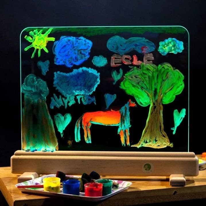 Magic Light Easel,The Magic Light Easel has magic tempered glowing glass on which you can paint on. Control unit of the device allows you to select from the range of 16 colours of the base lighting and every time create a new masterpiece. You can create a different impression of your piece of art only by changing the lighting. So, you should not immediately wipe out the landscapes you have created – change the colour and enjoy undiscovered ornaments of the drawing. Unlike a paper drawing that cannot be eras