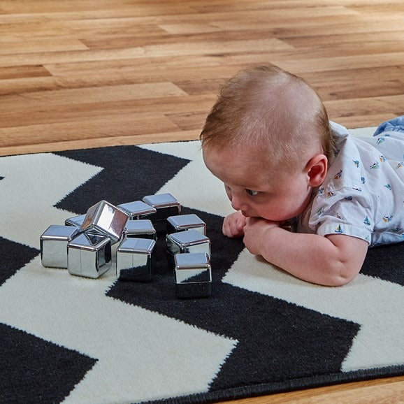 Mirror Cubes,This set of twelve Mirror Cubes have a shiny, smooth silver finish. They are light weight and easy to hold, yet durable. They are perfect for using as a sensory resource as well as for stacking and construction. Allows tactile and sensory exploration Mirrored surface provides opportunity to develop self awareness Size of each cube: W35 x D35 x H35mm. Supplied in a reusable drawstring cotton bag. Wipe clean only, do not submerge in water. Age Suitability: From Birth. Reasons to Love Perfect for 