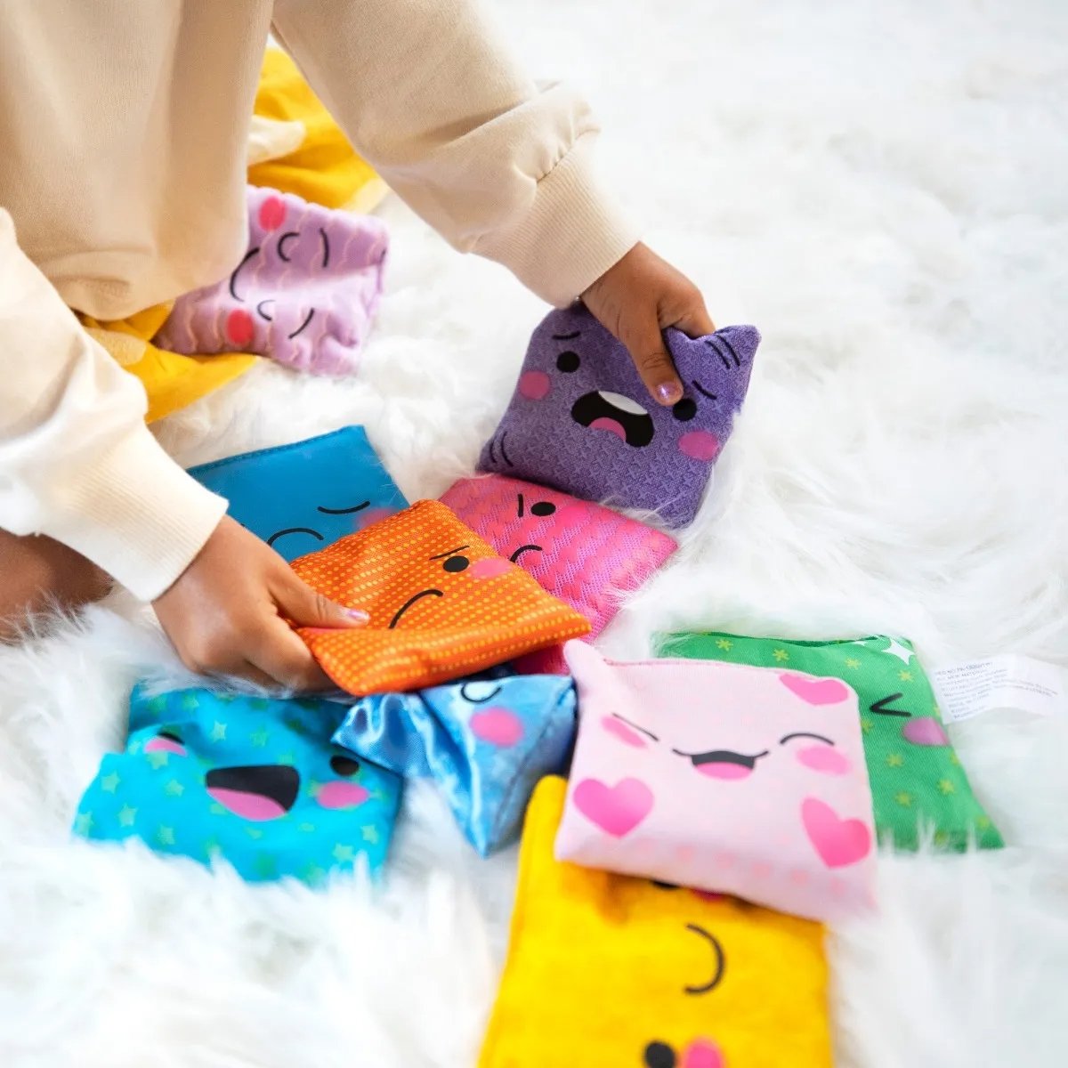 My Feelings Bean Bags,Help young children identify and express their feelings and emotions with this set of 10 tactile bean bags. Each My Feelings Bean Bag features a printed emotion image, including happy, sad, angry, surprised, loved, scared, peaceful, excited, sleepy, and disappointed, in a colour and texture that corresponds uniquely to that emotion. The My Feelings Bean Bags store in the included drawstring carry bag, and the set comes with a parent/teacher activity guide. Help young children express t