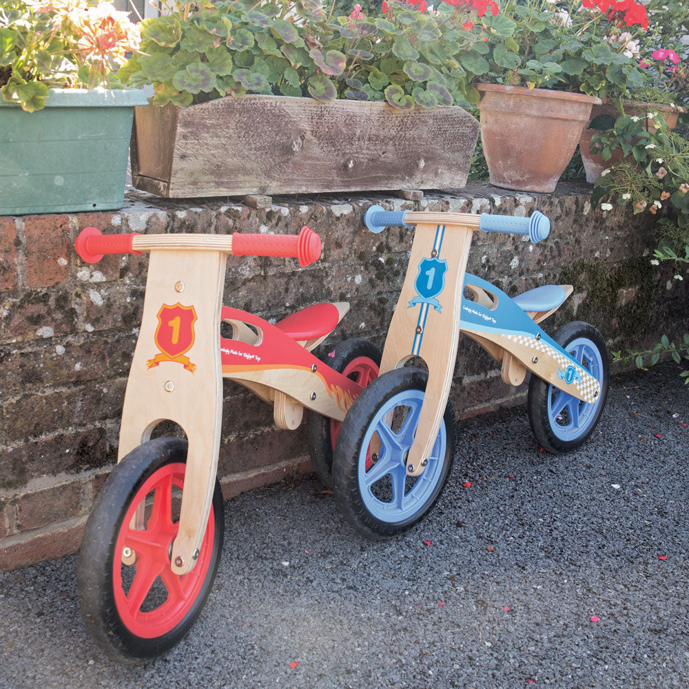 My First Balance Bike Blue,Introduce your little one to the joy of mobility with My First Balance Bike in Blue. Crafted from sturdy wood and designed with young riders in mind, this balance bike is the perfect way for toddlers to kick-start their journey towards two-wheeled adventures. Featuring a sleek blue design, this wooden balance bike is as stylish as it is functional. With its padded and adjustable seat, solid tyres, and easy-to-grip handlebars, it offers young riders a comfortable and secure riding 