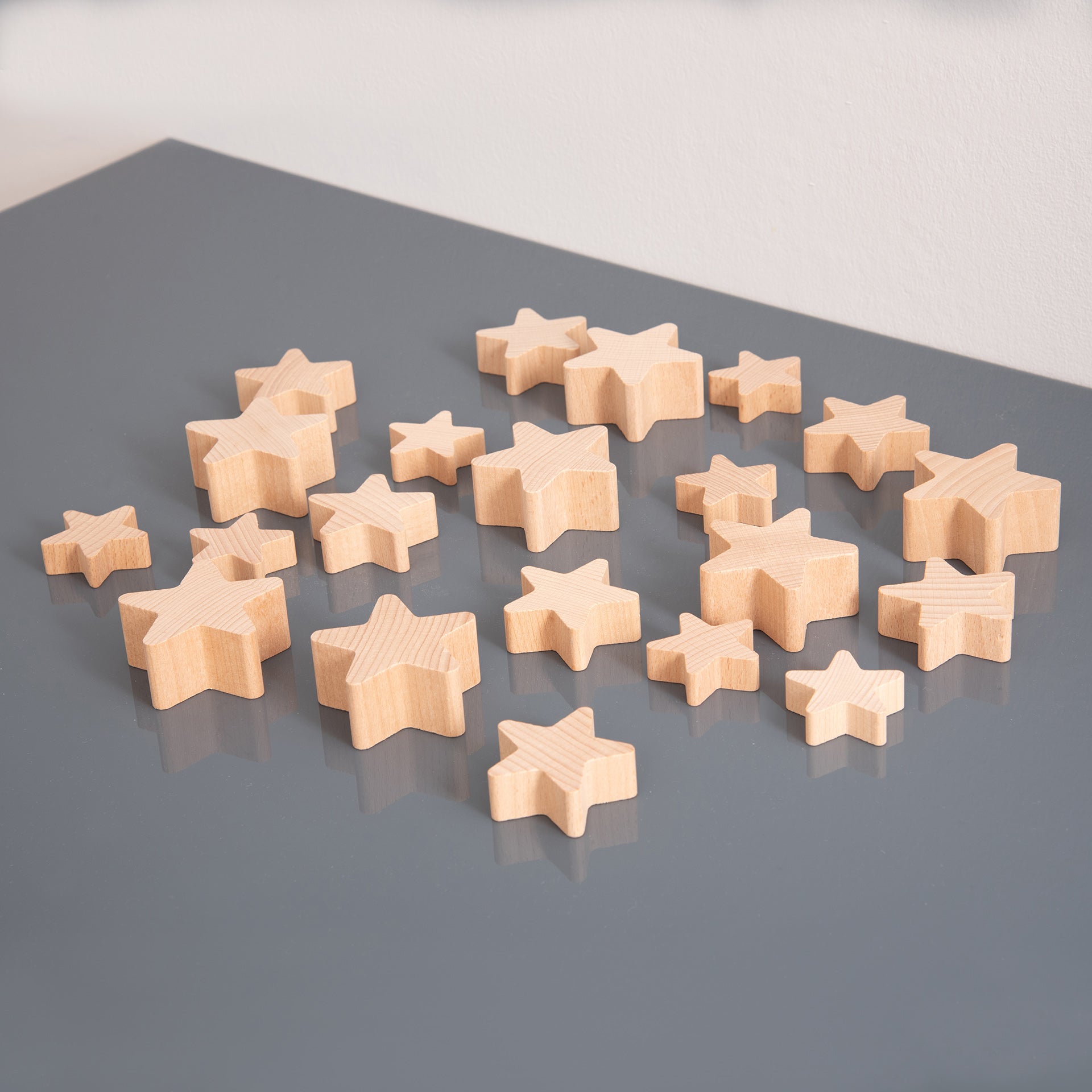 Natural Wooden Stars,Natural Wooden Stars Our TickiT® Natural Wooden Stars are crafted from smooth, solid beechwood with a natural woodgrain finish, making them a delightful and inspiring addition to any heuristic play range. These chunky and tactile stars are designed for easy manipulation by small hands, encouraging stacking, counting, sequencing, and exploratory play. Key Features: Smooth Solid Beechwood: Made from high-quality beechwood with a natural woodgrain finish, offering a tactile and visually ap