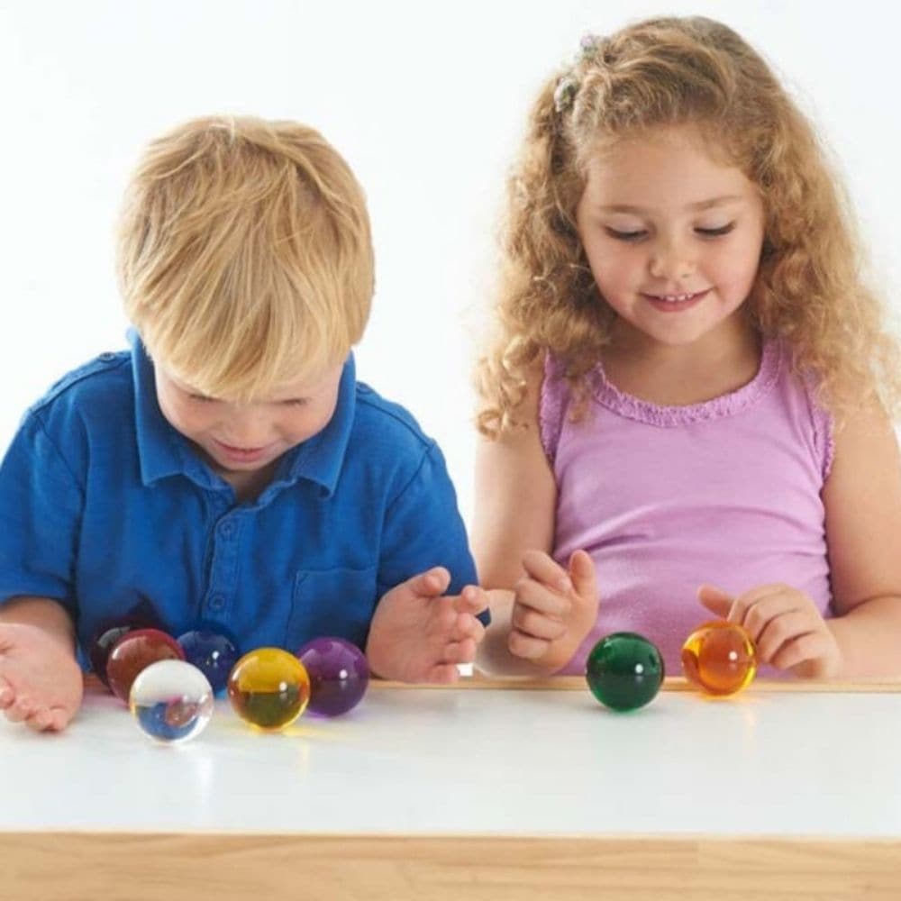 Perception Spheres Pack Of 8,The Perception Spheres come in eight different clear colours and are soft and warm to the touch. The very youngest children will enjoy handling the Perception Spheres in free sensory play or a part of a Treasure Basket collection. Older children will find the Perception Spheres fascinating as they hold them up and look through them seeing the world around them in different colours. The way light behaves when children look through the Perception Spheres they will also see the wor