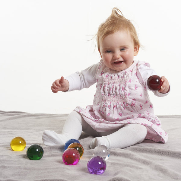 Perception Spheres Pack Of 8,The Perception Spheres come in eight different clear colours and are soft and warm to the touch. The very youngest children will enjoy handling the Perception Spheres in free sensory play or a part of a Treasure Basket collection. Older children will find the Perception Spheres fascinating as they hold them up and look through them seeing the world around them in different colours. The way light behaves when children look through the Perception Spheres they will also see the wor