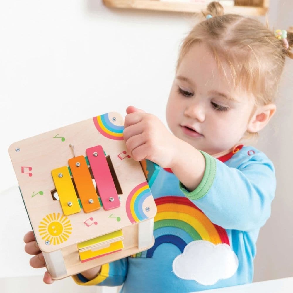 Petit Activity Cube,The Petit Activity Cube is a delightful and versatile wooden toy designed to engage and entertain toddlers with its array of stimulating activities. Here's why it's the perfect choice for curious little minds: Multi-functional compact design: This petite activity cube packs a punch with its variety of activities, including a door to open, spinning wheel, ABC/123 flaps, xylophone, spinning gears in a flower motif, and two birds sliding across an autumn tree. Each side offers a new and exc