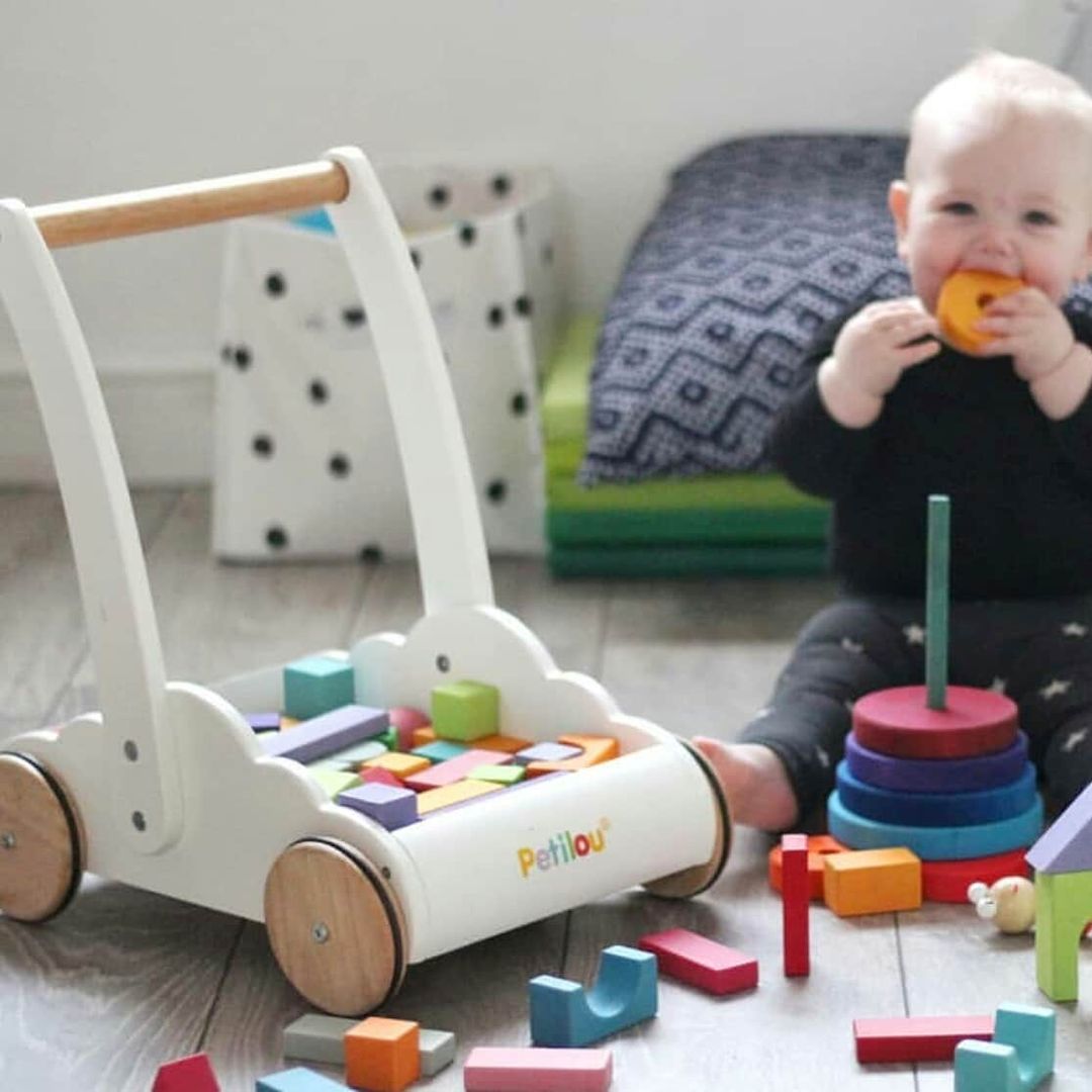 Rainbow Baby Walker & Puzzles,Rainbow Baby Walker & Puzzles: A Perfect Companion for Your Toddler's First Steps Get ready for some wheelie good fun with this traditional baby walker toy in a delightful rainbow cloud design. This charming walker is the ideal gift for toddlers who are just starting to find their feet, providing both support and entertainment as they embark on their walking journey. Key Features Sturdy Wooden Construction: Offers reliable support, helping little ones develop confidence, balanc