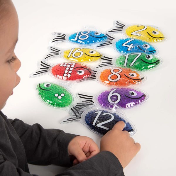 Rainbow Gel Number Fish,Vibrantly rainbow coloured Rainbow Gel Number Fish with numbers 0-20 on one side and their corresponding dots on the other. The Rainbow Gel Number Fish are Ideal for learning to count, to associate numbers with quantities, for colour recognition and for sensory play. The tactile squashy Rainbow Gel Number Fish contain gel-like beads in 7 crystal clear rainbow colours, with a loop at the top for hanging on a string or with pegs. The translucent colours contained within the Rainbow Gel