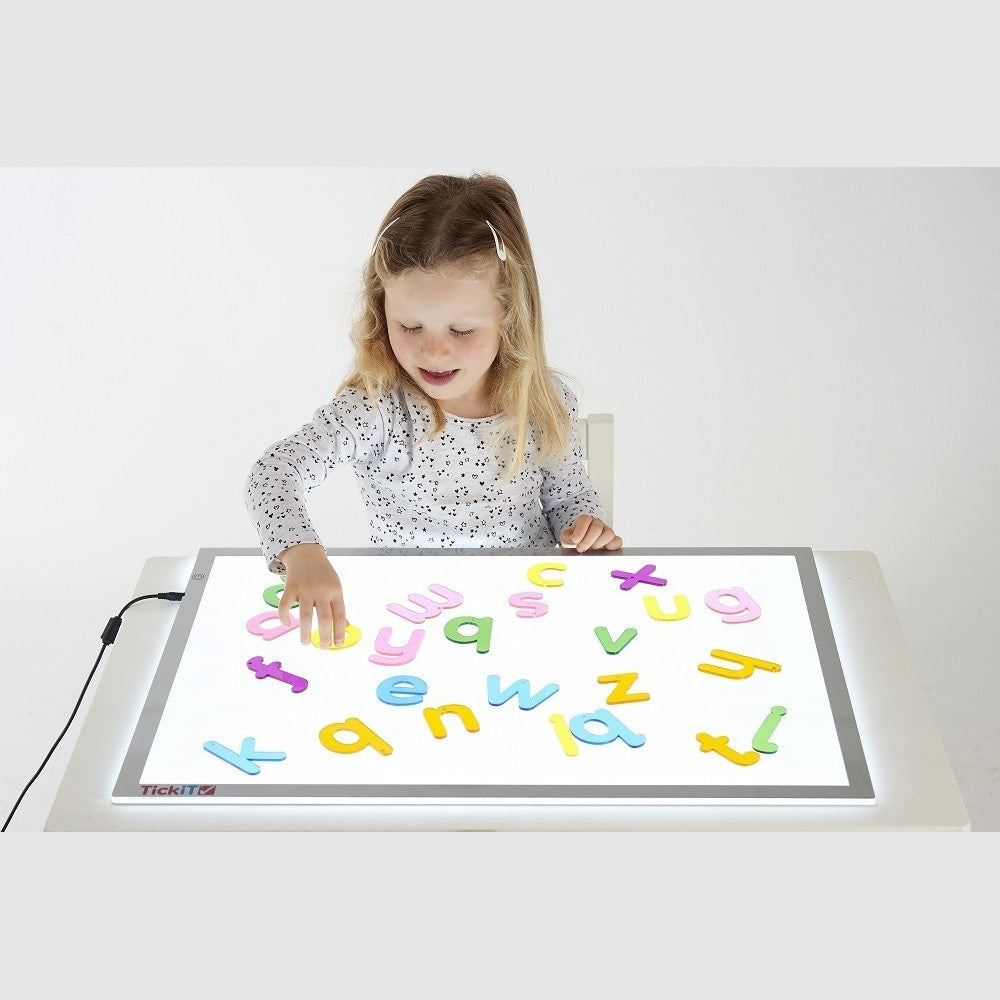 Rainbow Letters Pack Of 26,Introducing TickiT® Rainbow Letters, a vibrant and educational set designed to engage young learners in the wonders of the alphabet. Crafted from colourful clear acrylic, these letters come in a child-friendly font that is perfect for developing letter recognition and early literacy skills. The tactile nature of the Rainbow Letters, combined with their visually appealing colours, makes them an irresistible tool for children. They are encouraged to explore each letter by tracing it