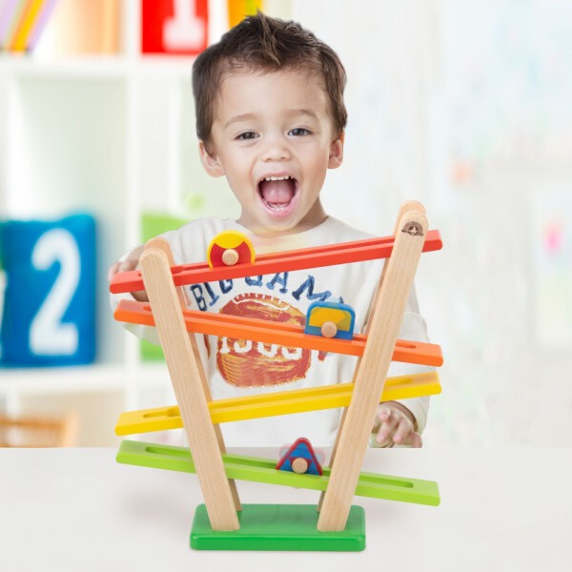 Rainbow Roller,Introducing the Colourful Rainbow Roller! The Colourful Rainbow Roller is a vibrant and engaging toy designed to bring excitement and joy to young children. Key Features: Interactive Play: Watch as the three different shaped wheels roll down the Rainbow Roller track, providing a delightful cause and effect experience for children. Adjustable Track: The Rainbow Roller features an adjustable track, allowing children to experiment with different configurations for endless fun. Stimulating Design