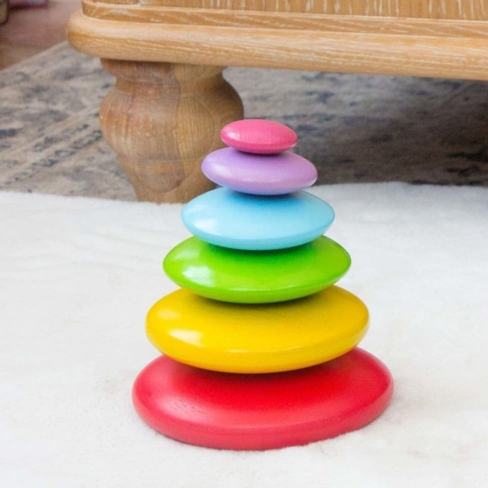 Rainbow Stacking Pebbles,Rainbow Stacking Pebbles: Endless Creative Play Carefully stack and balance the smooth Rainbow Stacking Pebbles before they tumble down! These vibrant, solid wood pebbles offer endless play possibilities, allowing creative youngsters to stack and balance them in as many ways as they can imagine. With no guidelines or rules, it's all about creativity and balance. Features and Benefits: Engaging and Fun Open-Ended Play: There are no rules or guidelines, so children can stack the pebbl