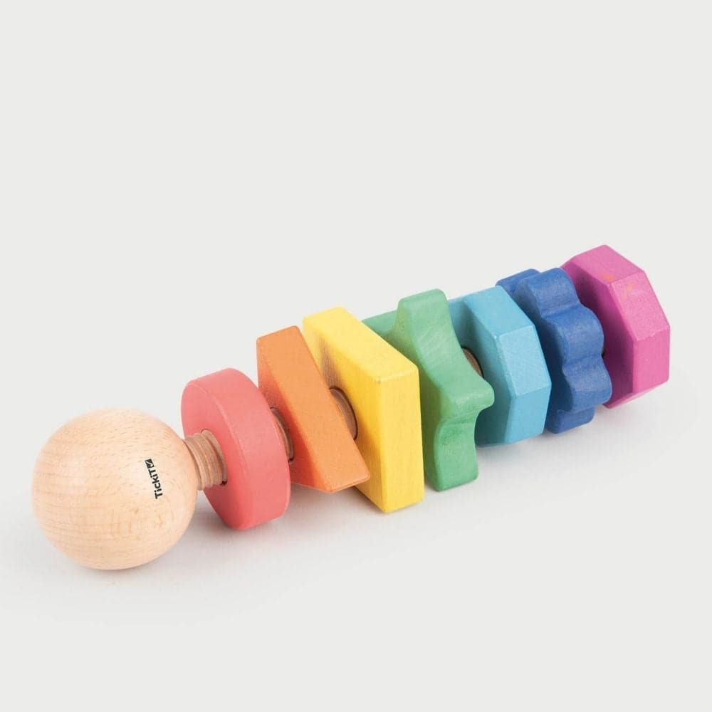 Rainbow Wooden Shape Twister,TickiT® Rainbow Wooden Shape Twister Our TickiT® Rainbow Wooden Shape Twister is a beautifully crafted educational toy made from smooth, solid beechwood with a natural woodgrain finish. Featuring the seven different colours of the rainbow, this giant bolt comes with seven nuts in various shapes, each with a different number of edges ranging from 1 (a circle) to 8 (an octagon). Key Features: Beautiful and Tactile: Smooth Beechwood: Made from high-quality beechwood, providing a na