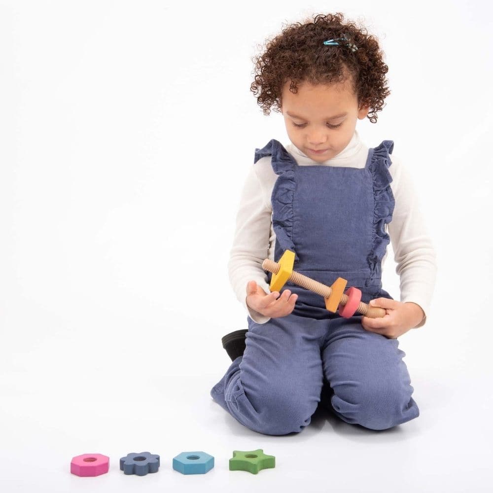 Rainbow Wooden Shape Twister,TickiT® Rainbow Wooden Shape Twister Our TickiT® Rainbow Wooden Shape Twister is a beautifully crafted educational toy made from smooth, solid beechwood with a natural woodgrain finish. Featuring the seven different colours of the rainbow, this giant bolt comes with seven nuts in various shapes, each with a different number of edges ranging from 1 (a circle) to 8 (an octagon). Key Features: Beautiful and Tactile: Smooth Beechwood: Made from high-quality beechwood, providing a na