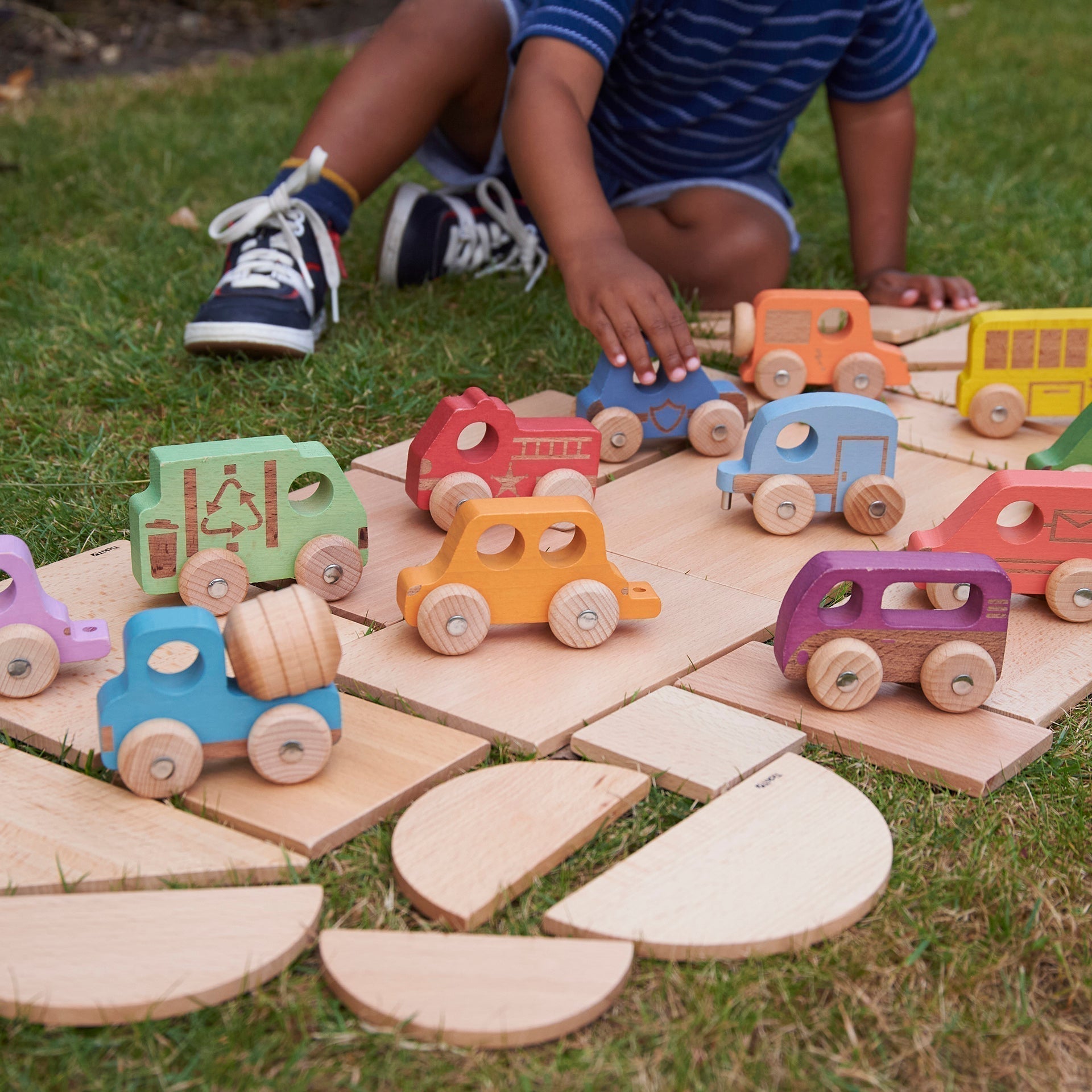 Rainbow Wooden Vehicles Set - Pk12,Our TickiT® Rainbow Wooden Vehicles are fantastic for little transport enthusiasts! The Rainbow Wooden Vehicles Set are made from beautiful smooth solid beechwood with a natural woodgrain finish in the 7 different colours of the rainbow. These colourful and tactile Rainbow Wooden Vehicles have intricate laser detailing, rotating wheels, and robust metal axles. Ideal for your child to use in imaginative play, small world play, and to encourage descriptive language skills an