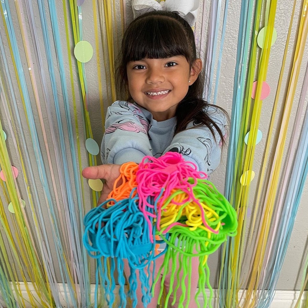 Schylling Ramen Noodlies,Ramen Noodlies are almost as irresistable as the real thing! You can squeeze, stretch, or mash these crimped textured noodles. Ramen Noodlies are brightly colored in 5 fluorescent tones and offer a unique sensory play experience that creates loads of endless fun. Toss them around with friends or squeeze a handful when you want to mellow out! NeeDoh Ramen Noodlies make a great gift and are perfect for schools, party favors, those with special needs, an addition to the office, and is 